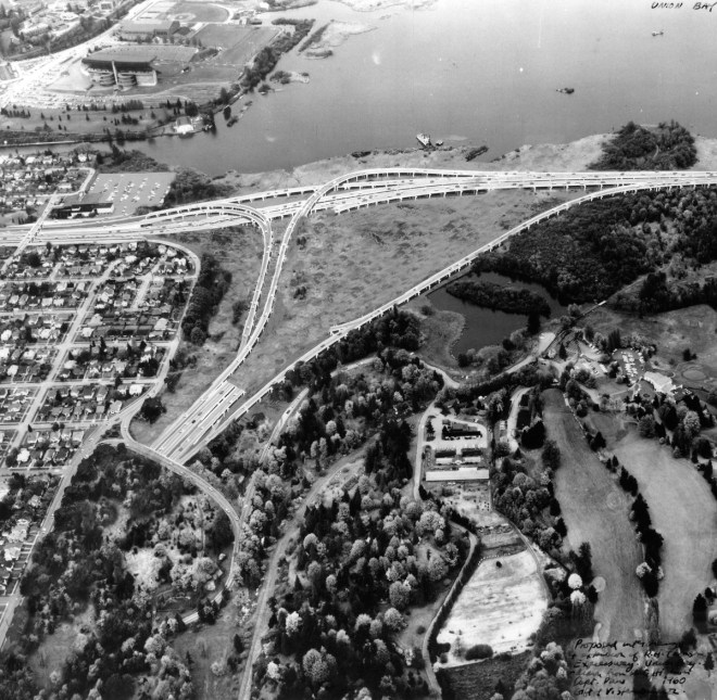 Aerial view of what was built in 1963. Husky Stadium and the Montlake Cut are in the upper left, Foster Island is in the upper right. The Arboretum is in the lower left and the Broadmoor Golf Course is lower right.